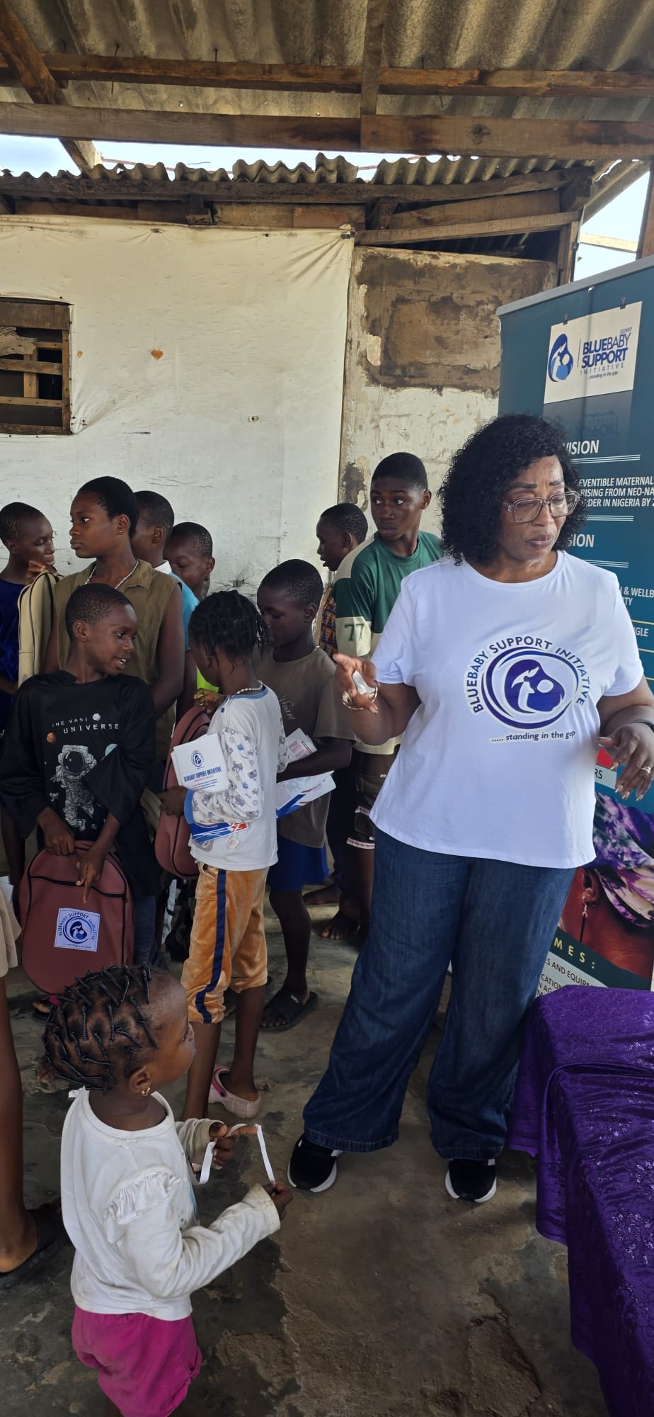 BBSI team member handing out relief packages