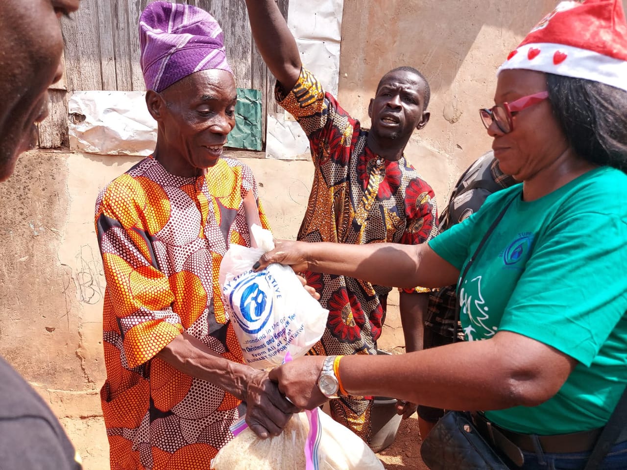 BBSI team member handing out relief packages