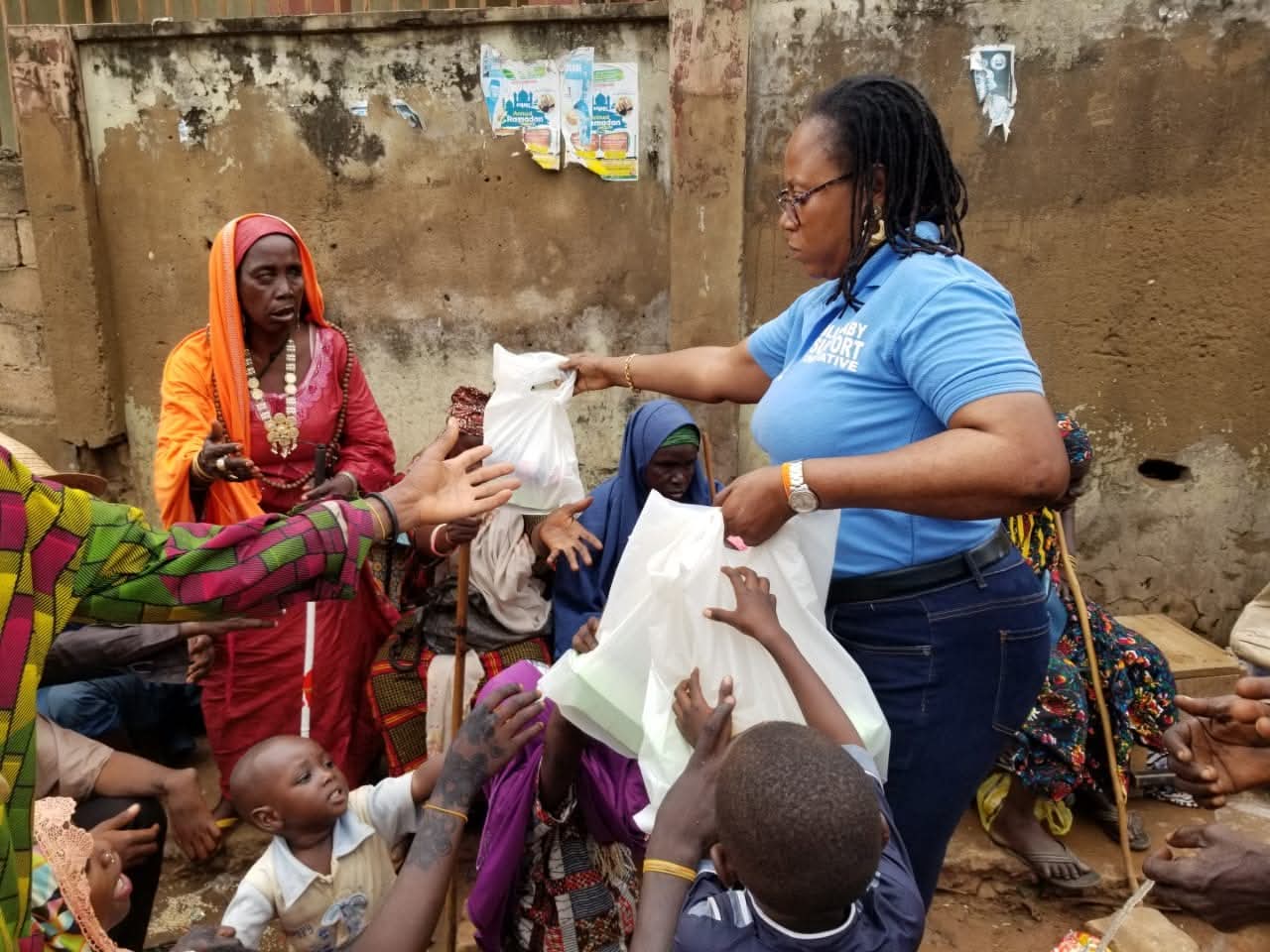 BBSI team member handing out relief packages