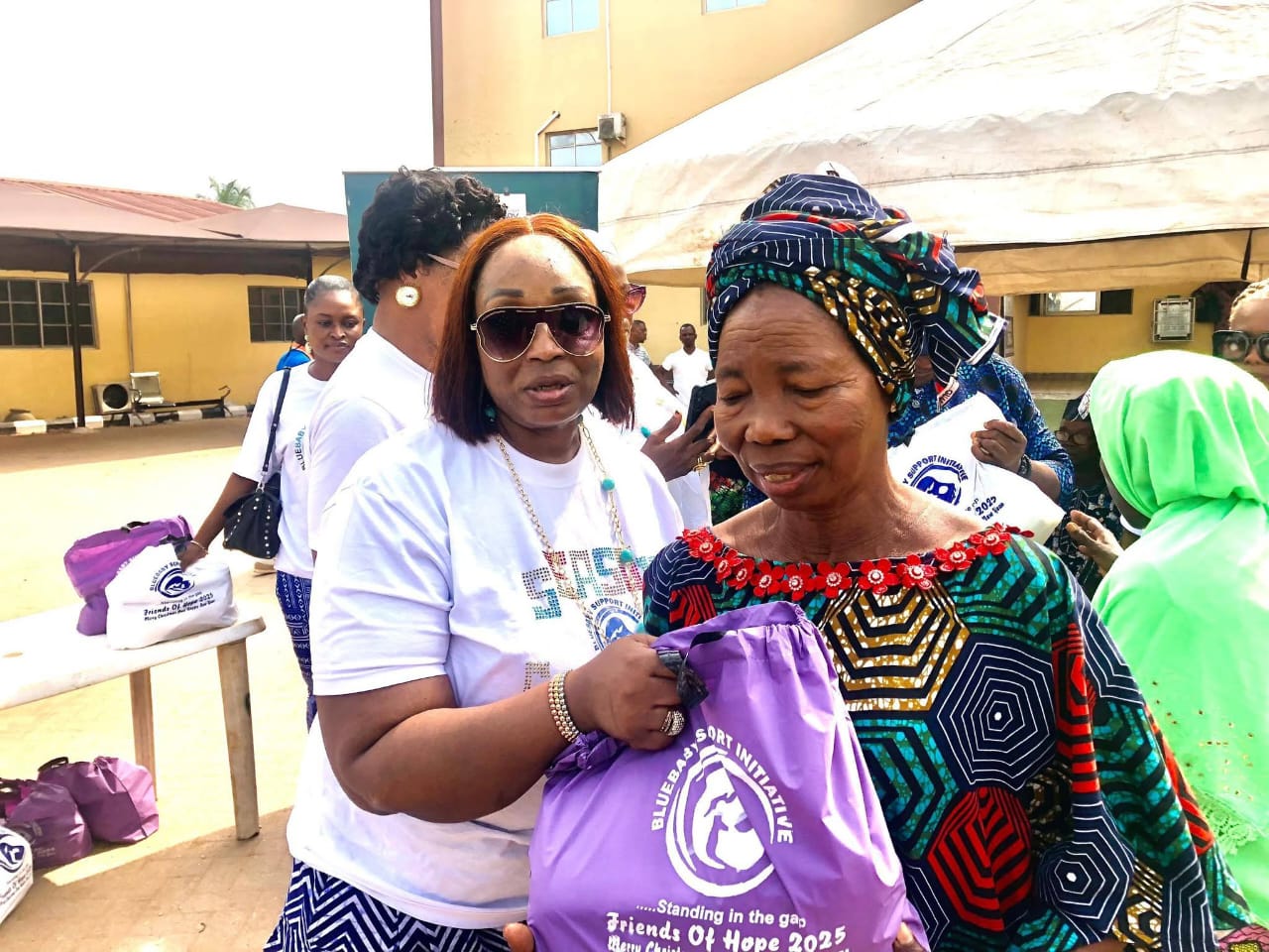 BBSI team member handing out relief packages