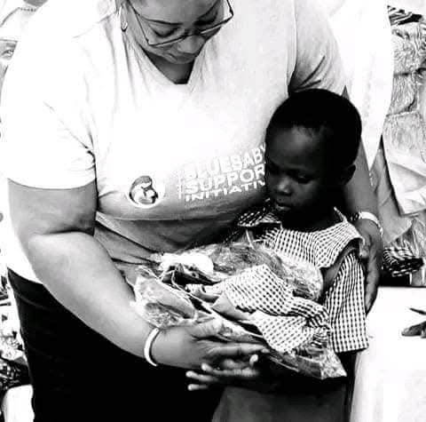 BBSI volunteers and pupils outside a classroom during the Project Kit Up A Child For School outreach